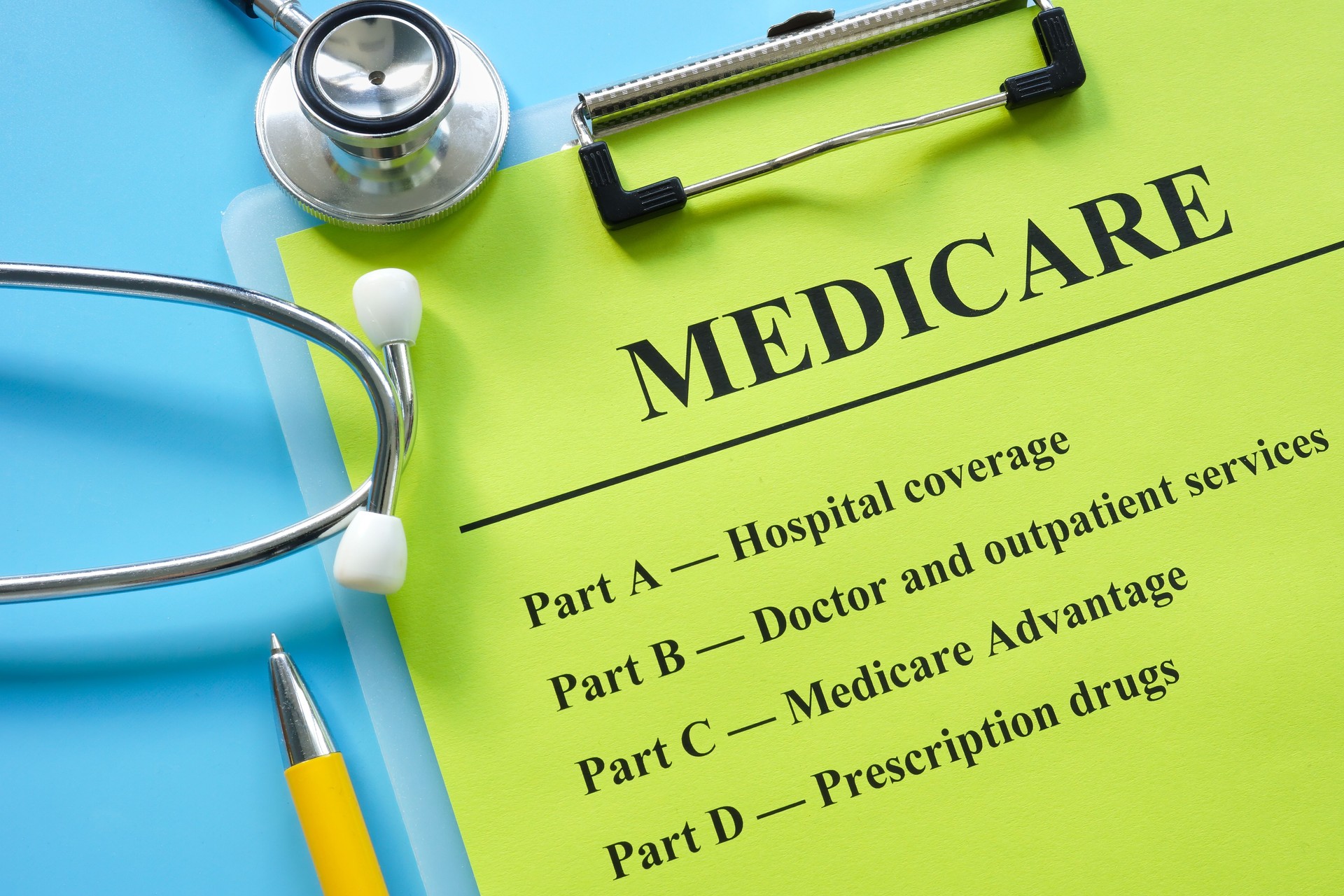 Papers about types of medicare insurance and stethoscope.