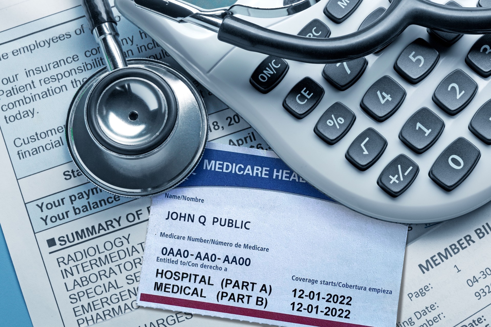 Medicare Insurance Card Stethoscope And Calculator On A Medical lnvoice